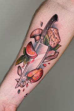 a tattoo on the arm of a man with a knife and tomato slices in it