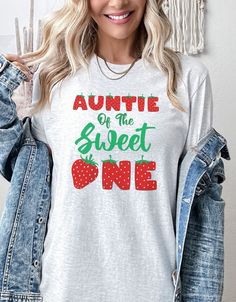 Auntie Of The Sweet One, Favorite Aunt Shirt, Aunt Gift from Niece, Cool Aunt Shirt, Strawberry Shirt, Strawberry Top, Strawberry Tshirt Welcome to LuxCC! We're thrilled to have you here and can't wait to share our collection of stylish and comfortable apparel with you. Whether you're looking for a casual, everyday piece or something a bit more unique, we've got you covered. As a small business, we truly appreciate your support. Every purchase you make helps us continue to do what we love and bring you the best possible products. We're committed to providing excellent customer service and ensuring that you have a positive shopping experience with us. Thank you for choosing to shop with us and for supporting our small business. We hope you love our products as much as we do! MATERIALS: .: 1 Sweet Long Sleeve Graphic Print Top, Sweet Long Sleeve Tops With Graphic Print, Long Sleeve Summer Tops For Birthday, Casual White Top For Birthday, Sweet Tops With Funny Print And Crew Neck, Casual Birthday Tops With Letter Print, Casual Letter Print Top For Birthday, Cute Long Sleeve Shirt With Text Print, Casual Cotton Tops For Birthday