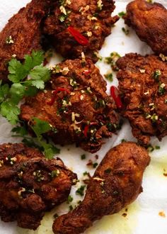 several fried meats with herbs and seasoning on top