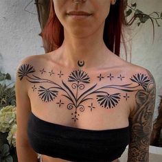 a woman with a tattoo on her chest