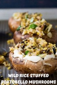 baked stuffed potatoes with wild rice and mushrooms on the top are ready to be eaten