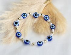 evil eye bracelet with 14k or faux gold spacer beads all around Evil Eye Jewelry Bracelet, Gold Arm Band, Gold Armband, Bracelets Diy, Bracelet Ideas, Beaded Bracelets Diy, Eye Bracelet, Cute Bracelets, Evil Eye Bracelet