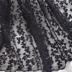 black lace fabric with flowers and sequins