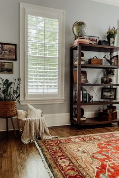 a living room filled with furniture and a rug