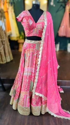 Beautiful pink patch work print lehenga choli. Lehenga is made from patchwork printed georgette fabric with mirrors and zari work.  We can customize the blouse style if you prefer.  Size: Please choose a standard size from the drop-down or your can choose custom measurements. The dress will be made to order in the size you choose or for custom measurements, I'll send you a measurement sheet once you order. Bohemian Dola Silk Lehenga For Weddings, Bohemian Dola Silk Choli For Wedding, Unstitched Bohemian Lehenga In Georgette, Pink Chanderi Choli With Gota Work, Designer Pink Chanderi Lehenga, Pink Chanderi Lehenga For Designer Wear, Pink Chanderi Lehenga For Festivals, Bohemian Lehenga With Zari Work, Bohemian Designer Lehenga With Dupatta