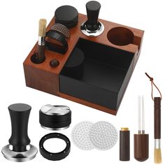 a wooden box with various items in it, including an object like a cup holder and other accessories