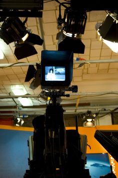 a camera set up in front of some lights