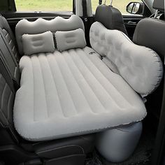 an inflatable car seat with two pillows on it