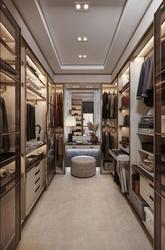 a walk in closet with lots of clothes