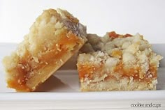 two pieces of cake sitting on top of a white plate