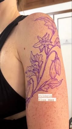 a woman with a tattoo on her arm