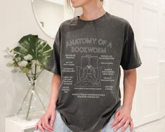 Anatomy of a Bookworm Tshirt Literacy Bookish Tshirts BookTok Smut Romance Reader Tee Trendy Oversized Bookcore T Shirt  Book Club Gift Literature Author Librarian Trendy English Teacher Always Reading Bibliophile Writer Literacy Gift Academia Vibes Vintage Rather Be Reading  Gift For Her Trendy Academia Vibes Perfect for Librarian or Teacher or any Book Lover Bibliophile Comfort Colors® 1717 T-shirt * Comfort Colors brand * Unisex Adult Sizing * 100% Ring-spun Cotton * Medium weight fabric, relaxed fit * Sewn-in twill label * Double-needle sticking through the tee, making it highly durable, while the lack of side-seams helps the shirt retain its tubular shape. * Direct To Garment (DTG) printing simply means the ink is printed directly into the fabric with love ❤   - - - CARE - - -   * Mac Bookworm Tshirts, Romance Reader, Bookclub Gifts, Reading Gifts, Romance Readers, Book Boyfriends, Dtg Printing, English Teacher, Book Lover