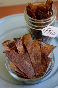 kombucha scooby dog treats in a glass jar on a plate