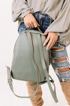 You won't want to let this adorable pear colored backpack get hidden in the back of your closet with its sleek faux leather material, two additional outside pockets, a single handle, two adjustable shoulder straps, and a spacious pouch with a zip closure and additional inside pockets! Trendy Green Leather Backpack, Everyday Faux Leather Backpack With Adjustable Strap, Fall School Backpack With Adjustable Strap, School Backpack With Adjustable Strap For Fall, Trendy Green Leather Standard Backpack, Spring Green Backpack For Everyday Use, Green Backpack For Everyday Use In Spring, Green Backpack For Everyday Spring Use, Green Casual Leather Backpack With Zipper Closure