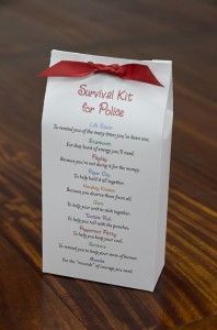 a survival kit for healthcare caregivers on a wooden table with a red ribbon