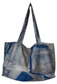 a bag made out of old jeans on a white background with the bottom section ripped off