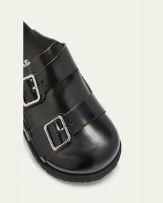 BIRKENSTOCK "West" smooth leather comfort clogs.    0.4" flat heel.    Round toe.    Dual buckle strap at vamp.    Slide style.    Molded footbed.    Lightweight, flexible EVA outsole.    Made in Germany. Smooth Leather, Birkenstock, Clogs, Tops Designs, Germany, Buckle, Luxury Fashion, Heels, Leather