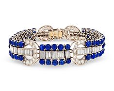 The chic sophistication and glamour of the Art Deco period comes alive in this breathtaking sapphire and diamond bracelet. An impressive 25.00 combined carats of royal blue cabochon sapphires join dozens of sparkling white diamonds totaling 9.45 carats. Crafted of platinum, its eye-catching, geometric setting completes this incredible design.Circa 19307 1/4" length Luxury Art Deco Jewelry With Center Stone, Luxury Art Deco Jewelry With Hand-set Details, Luxury Gia Certified Art Deco Jewelry, Luxury Art Deco Jewelry With Intricate Design, Luxury Art Deco Jewelry Gift, Luxury Art Deco Jewelry, Luxury Art Nouveau Blue Jewelry, Luxury Antique Diamond Bracelets, Luxury Art Deco Jewelry With Gemstone Accents