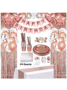 a birthday party set up with pink and gold balloons, streamers, plates, napkins