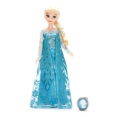 a frozen princess doll is standing next to a ball