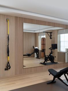 the gym is clean and ready for people to use it as an exercise center in this modern apartment