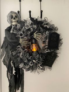 a skeleton wreath hanging on the wall