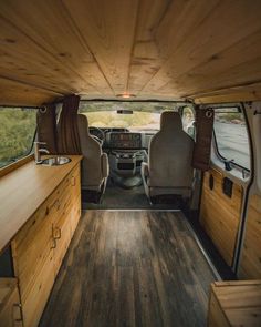 the interior of a van with wood flooring