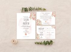 wedding stationery with flowers and greenery