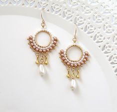 "These pearl and gold earrings are long, dainty, dangly, and delicate, perfect as an elegant fashionable statement! Made by hand, from gold plated castings, Swarovski 3mm pearls, Swarovski drop, Miyuki round seed beads, and goldfilled 14k ear-wire Can be worn on any occasion elegant or casual or as a unique gift to a woman that you want to indulge! Measurements: Earring length: 2.36\" (6cm) Earring width: 0.98\" (2.5cm) PACKAGING: ♡ Arrives in a hard jewelry gift box - ready to be given as a gif Elegant Rose Gold Earrings With Dangling Beads, Gold Bohemian Beaded Earrings With Pearl Drop, Delicate Gold Beaded Earrings, Rose Gold Dangling Beads Earrings For Gift, Rose Gold Earrings With Dangling Beads For Gift, Elegant Rose Gold Beaded Dangle Earrings, Gold Bohemian Beaded Earrings For Wedding, Bohemian Gold Beaded Earrings For Wedding, Gold Dangle Earrings Wedding