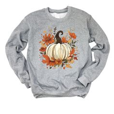 Looking for a cute versatile top to wear this summer? Make sure to grab one of our Fall Pumpkin Floral Sweatshirts! This soft and comfortable shirt is the perfect top for any outfit. It can be paired with biker shorts, Jeans, or the classic stay at home sweats! The bright color adds a pop of summer to any outfit. This sweatshirt is true-to-size, so be sure to order your regular size! If you are looking for a more oversized look, make sure to size up. Gray Relaxed Fit T-shirt For Fall, Comfortable Cotton Tops For Fall, Comfortable Crew Neck Tops For Fall, Comfort Fit Fall Top, Comfortable Fit Crew Neck Tops For Fall, Soft-washed Comfortable Fit Tops For Fall, Soft-washed Comfort Fit Top For Fall, Fall Sweatshirt, Oversized Look