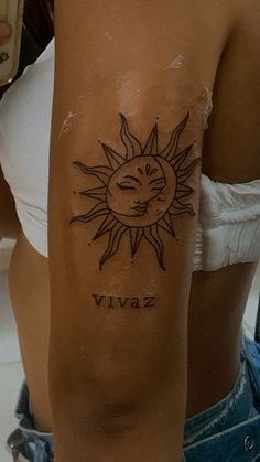 a woman's arm with a sun and the word vivaz tattooed on it