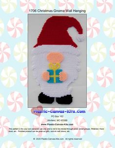 a christmas gnome with a present on it's chest is featured in this cross stitch pattern