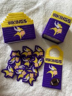 the minnesota football team has been made out of plastic and beaded with purple thread