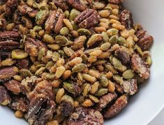 a bowl filled with nuts on top of a table