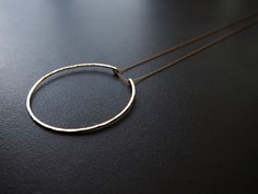 "Simple Circle Necklace  A simple circle shape on a delicate 18\" or 24\" chain. Diameter of circle: 2.25\" Necklace is shown on a 18\" chain. Available in solid sterling silver (925) and 14k gold fill.  green tea leaves is handcrafted, cut, shaped, and finished with a lightly hammered texture.  Is this a gift? All pieces arrive ready to gift. Please let me know the recipient's shipping address in a \"Note to Seller.\"" Gold Hoop Sterling Silver Necklace, Sterling Silver Hoop Necklaces In Gold Color, Gold Hoop Sterling Silver Necklaces, Gold Sterling Silver Hoop Necklaces, Sterling Silver Hoop Necklace In Yellow Gold, Sterling Silver Hoop Necklace As A Gift, 14k Gold Hoop Necklaces For Gifts, Gold Full Circle Jewelry With Delicate Chain, Gold Jewelry With Delicate Full Circle Chain