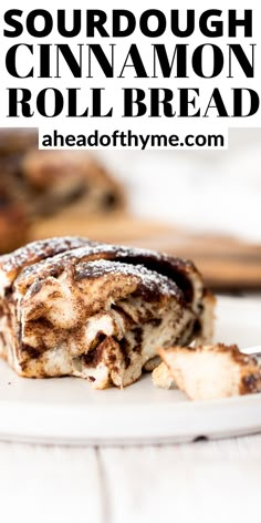 a close up of a piece of bread on a plate with the words sourdough cinnamon roll bread