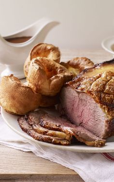 roast beef and bread on a white plate