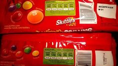 two bags of skittles sitting on top of each other next to each other