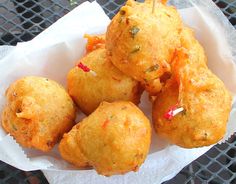 several fried food items in a basket on a table