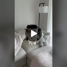 a coffee cup sitting on top of a white couch