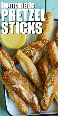 homemade pretzel sticks on a plate with dipping sauce