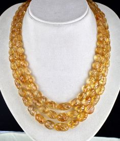 PRODUCT DETAILS LINE 3/CTS 792 NATURAL CITRINE BEADS  ALL NATURAL GEMSTONE OLD ANTIQUE BEADS BEST YELLOW COLOR  SIZES OF THE BEADS ARE FROM 20 MM TO 8 MM NECK LENGTH OF THE NECKLACE IS 17 INCHES  OUTER LENGTH OF THE NECKLACE IS 20 INCHES  ATTACHED TO SIZABLE SILK CORD BEST CARVED STONES  BUY IT NOW... NOTE - #You will receive the same product you see in picture. #DEAR BUYERS PLEASE FEEL FREE TO ASK QUESTIONS  #WE WILL BE GLAD TO ANSWER & SOLVE QUERY REGARDING THIS PRODUCTS #RETURN POLICY Every piece of jewellery and inputs (gem stones, diamonds, making and setting) is tested by our team of experts and experienced artisans to generate maximum satisfaction to our valued customers. Customer satisfaction is our primary goal. All information about the material used in jewellery, except for typo Citrine Beads, Yellow Gemstones, Silk Cord, Aquamarine Stone, Natural Citrine, Gold Choker, Bead Stringing, Stone Carving, Fashion Vintage