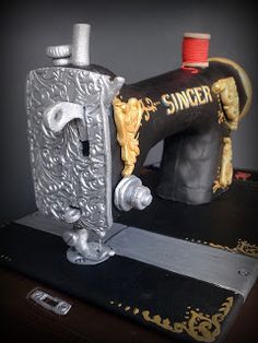 an old fashioned sewing machine sitting on top of a table