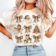 a woman with blonde hair wearing a t - shirt that has christmas decorations on it