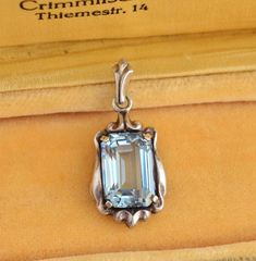 An elegant Jugendstil (Art Nouveau era) 800 silver pendant decorated with an emerald cut blue spinel.  Height (incl. bale) 2.8 cm x 1.3 cm ( 1.1" x 0.5") Weight: 3.7 grams Hallmarked: 800 for European silver   Very good vintage condition Will be delivered by tracked and signed mail. Thank you for looking. Please see my other items. Formal Sterling Silver Jewelry With Rectangular Stone, Formal Silver Jewelry With Rectangular Stone, Elegant Hallmarked Rectangular Pendant Jewelry, Elegant Octagon Blue Topaz Jewelry, Blue Rectangular Pendant Jewelry For Formal Occasions, Elegant Blue Topaz Octagon Jewelry, Blue Rectangular Pendant Fine Jewelry, Elegant Rectangular Stone Formal Jewelry, Formal Blue Square Pendant Jewelry