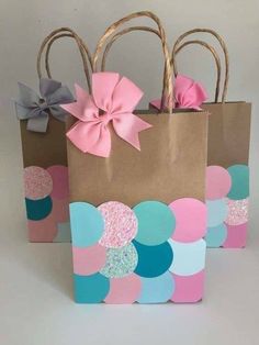 some paper bags with bows on them are sitting in front of an instagram page