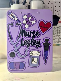 a purple magnet with nurse stickers on it