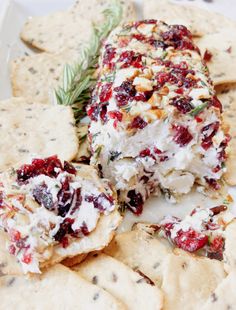 cranberry cheese appetizer with crackers and rosemary sprigs