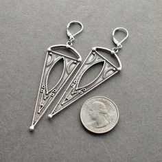 Boho Triangle Earrings: Beautiful, bold, and totally versatile, these silver dangle earrings are equally suited to a music festival or a downtown cafe. They'll make you feel like the goddess you are! ✧ 3.25 inches long ✧ Comfortably lightweight at 5 grams each (same as a US nickel) ✧ Leverback hooks in your choice of silver-plated, stainless steel, or sterling silver ✧ Gift-ready in attractive, earth friendly box ✧ Handmade just for you, ready to ship in 3-6 business days SHOP EARRINGS: https:// Bohemian Nickel Free Teardrop Clip-on Earrings, Bohemian Pierced Linear Earrings As Gift, Bohemian Teardrop Nickel Free Clip-on Earrings, Bohemian Nickel-free Teardrop Clip-on Earrings, Bohemian Teardrop Nickel-free Clip-on Earrings, Bohemian Pierced Teardrop Earrings In Sterling Silver, Bohemian Metal Linear Earrings For Pierced Ears, Teardrop Metal Earrings For Festival, Festival Long Drop Earrings With Ear Wire