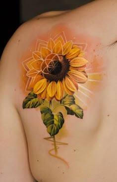 a woman with a sunflower tattoo on her shoulder